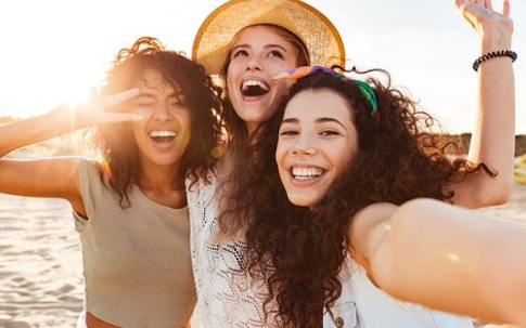Three young women on the beach